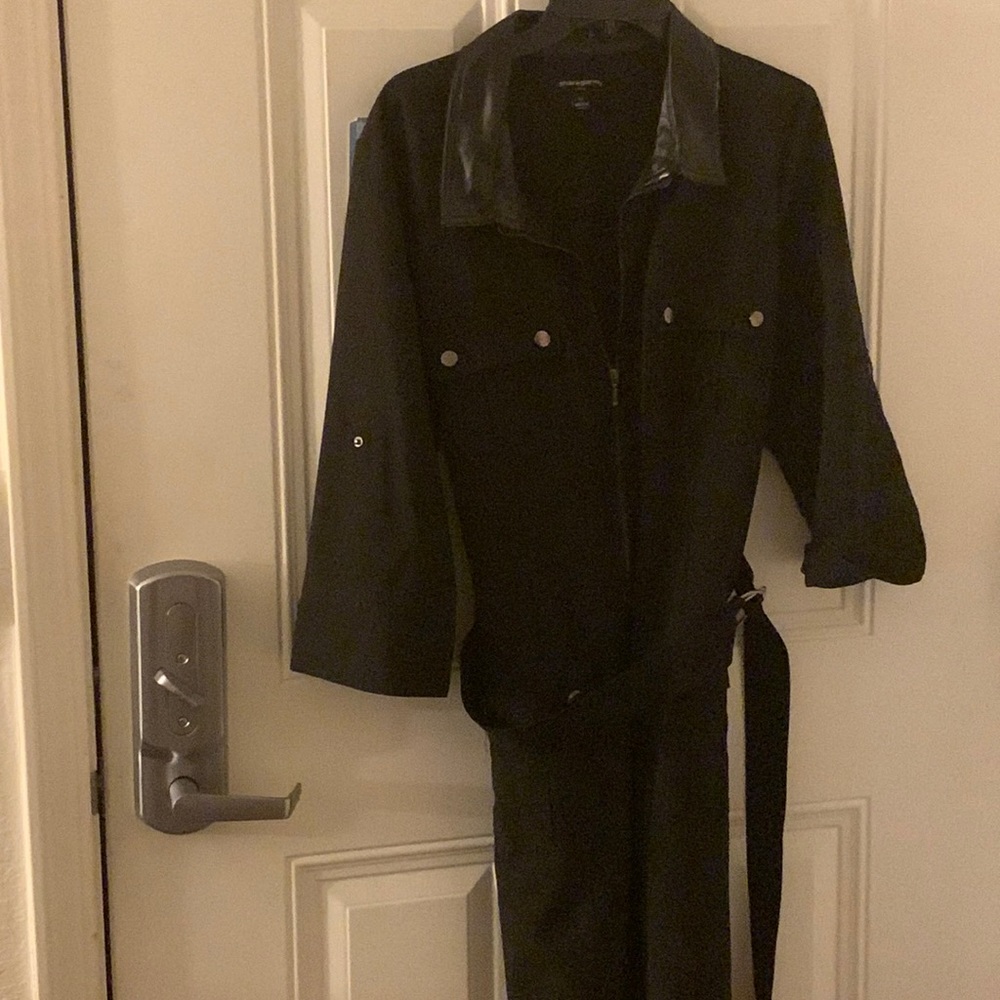 Black zip front knee length dress with faux leather on the collar and sleeves